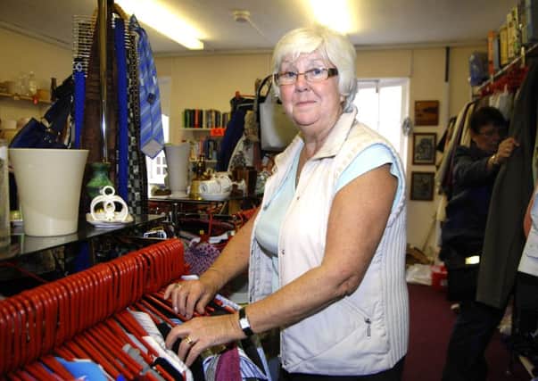 Volunteer Val Render from the Leonard Cheshire Disability Charity Shop. 110601AR5pic2.