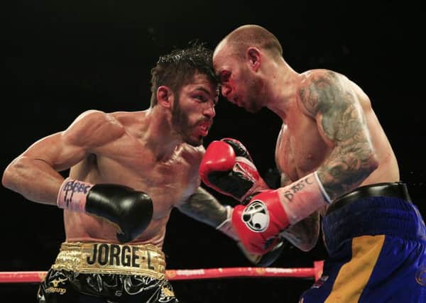 Kevin Mitchell (right) in action with Jorge Linares in their WBC World lightweight title fight at the O2 Arena, London