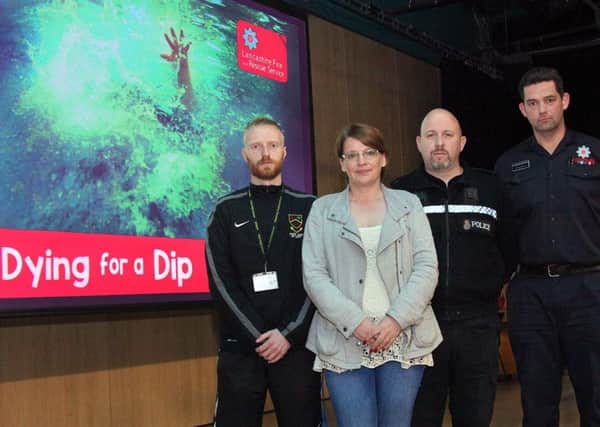Andrew Ackroyd, Mel Goodship, Emlyn Parry and Chris Walton at Park High School in Colne where Lancashire Fire and Rescue were presenting its "Dying for a Dip" water safety campaign to pupils. (S)