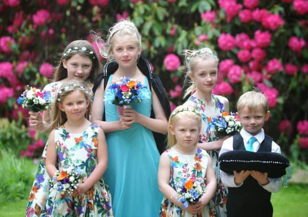 Pictured back left, Abigail Dewhurst (10), new queen Hannah Bettess (11), Sophia Bettess (10), Oscar Bailey (6). 
Front left, Ella Davies (6), Mia Davies (4) at the crowning of Sabden's rose queen. Picture: Julian Brown