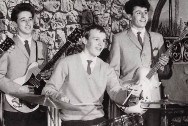 STARS: Tony, Bobby and Bernie playing as The Dolphins in Burnley. Tony is holding a Maton guitar that was later played by George Harrison and was recently auctioned in New York for $300,000