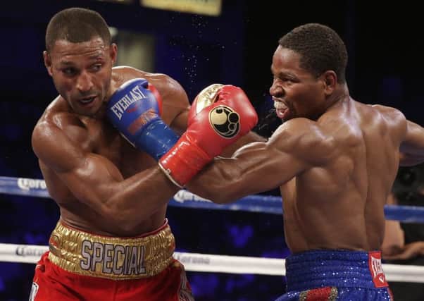 Shawn Porter, right, and Kell Brook trade punches during their IBF welterweight title boxing bout Saturday, Aug. 16, 2014, in Carson, Calif. (AP Photo/Chris Carlson)