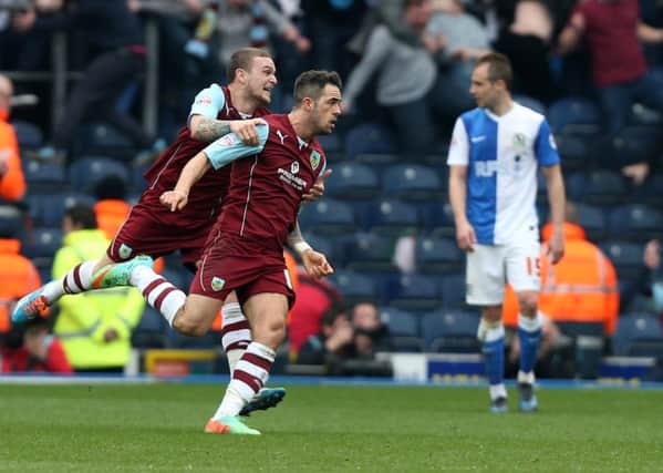 Burnley's Danny Ings celebrates scoring the second goal during the Sky Bet Championship match at Ewood Park, Blackburn. PRESS ASSOCIATION Photo. Picture date: Sunday March 9, 2014. See PA story SOCCER Blackburn. Photo credit should read: Peter Byrne/PA Wire. RESTRICTIONS: Editorial use only. Maximum 45 images during a match. No video emulation or promotion as 'live'. No use in games, competitions, merchandise, betting or single club/player services. No use with unofficial audio, video, data, fixtures or club/league logos