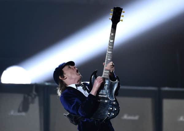Angus Young of AC/DC performs at the 57th annual Grammy Awards  in Los Angeles. (Photo by John Shearer/Invision/AP)