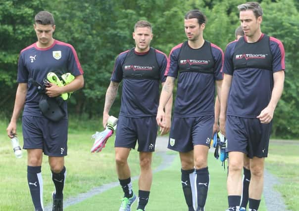 Burnley players Matt Lowton, Michael Kightly, George Boyd and Michael Duff return to training.