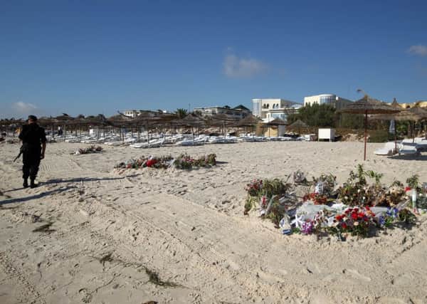 Flowers on the beach near the RIU Imperial Marhaba hotel in Sousse, Tunisia, where 38 people lost their lives after a gunman stormed the beach