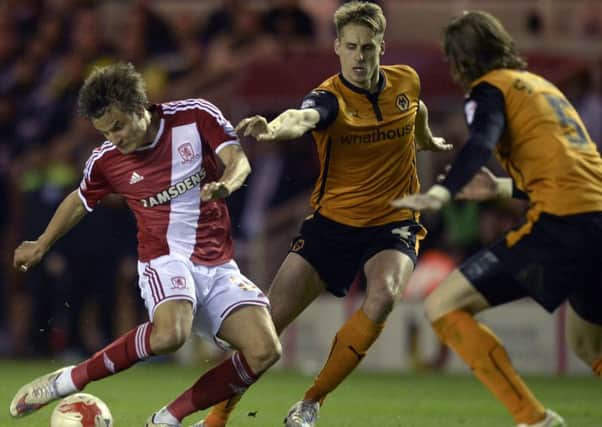 Middlesbrough's Jelle Vossen battles with Wolves Dave Edwards during the Sky Bet Championship match at the Riverside Stadium. Photo: Owen Humphreys/PA Wire.