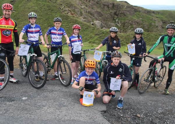 Cyclist Ian Wilkinson and Paul Oldham with students from Ribblesdale High School and Pendle Vale College at the launch of the Stage 2 Tour of Britain.