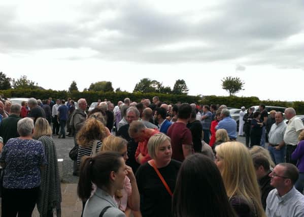 Hundreds gather outside Billington and Langho Community Centre to hear plans for a multi-faith burial ground off Northcote Road.