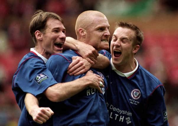 Sean Dyche is mobbed by his Chesterfield team mates after scoring