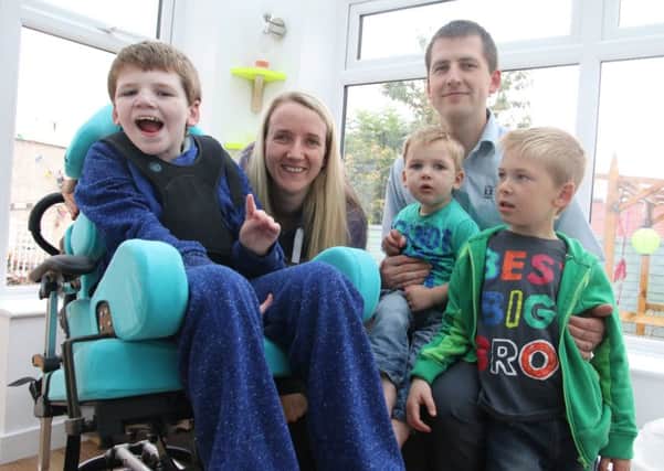 Jake Green (13) with his mum Simmone, dad Andy and brothers James (5) and Euan (18 months).