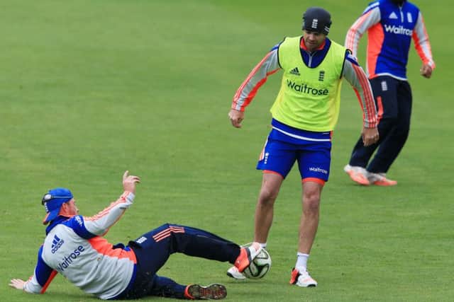 England's James Anderson is tackled by teammate Ian Bell as the team warm up with a game of football before the nets session at Edgbaston, Birmingham. PRESS ASSOCIATION Photo. Picture date: Tuesday July 28, 2015. See PA story CRICKET England. Photo credit should read: Nick Potts/PA Wire. RESTRICTIONS: Editorial use only. No commercial use without prior written consent of the ECB. Still image use only no moving images to emulate broadcast. No removing or obscuring of sponsor logos. Call +44 (0)1158 447447 for further information