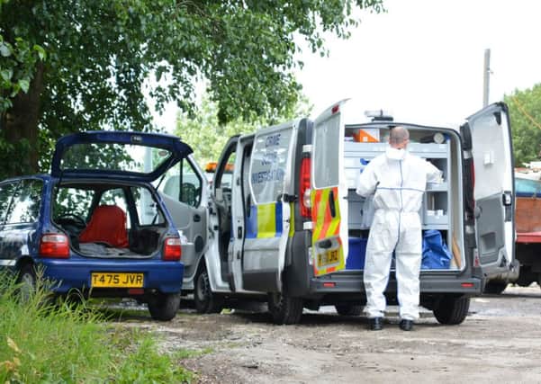Police inspect the scene where Stephen Whitehead was found dead