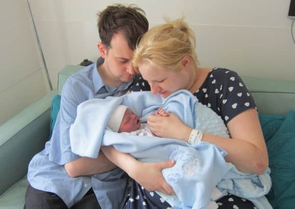 Dominic Leo Lord with his parents Viki and Daniel (s)