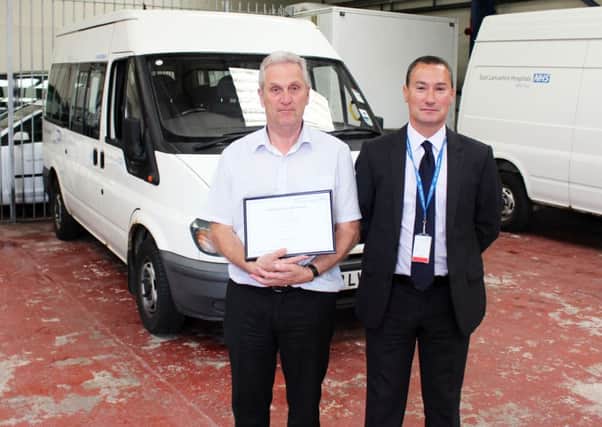 Andy Driver (left) after being presented with East Lancashire Hospitals NHS Trust employee of the month award.