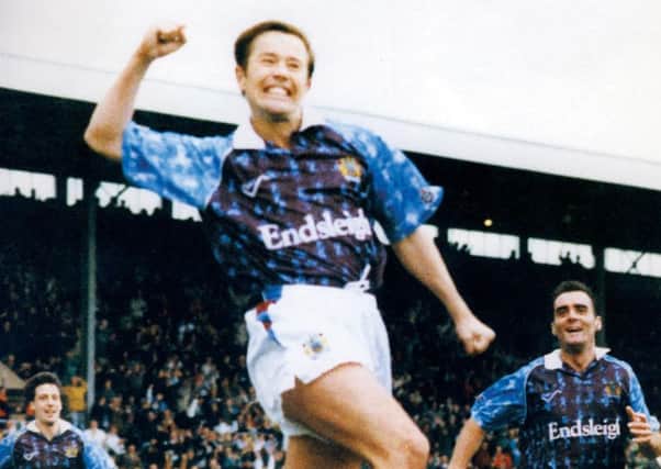 Adrian Heath celebrates a goal in the Ribero kit of the early 90s
