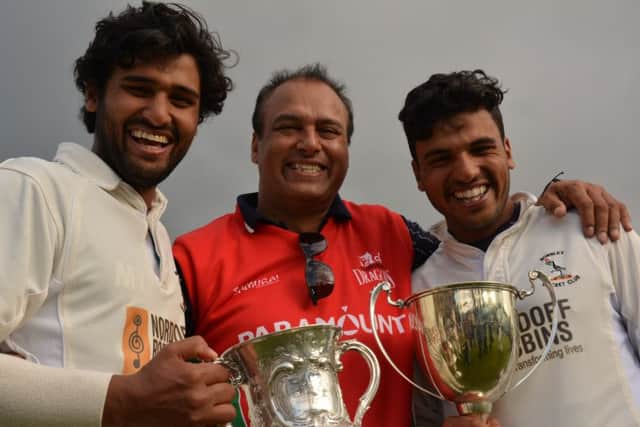 Bharat Tripathi, Pankaj Tripathi and Vishal Tripathi of Burnley Cricket Club celebrate the 2015 Worsley Cup success at Nelson Cricket Club.  Photo Kelvin Stuttard