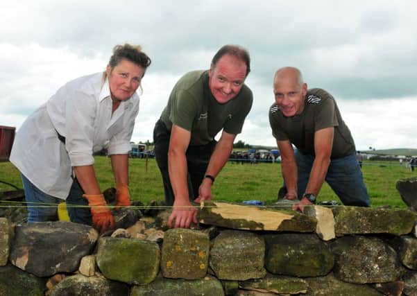 Photo: David Hurst Competitors in the Dry Stone Walling Challenge, Perri Webster, Tom Swailes and Harry Atkinson at Trawden and District Agricultural Show