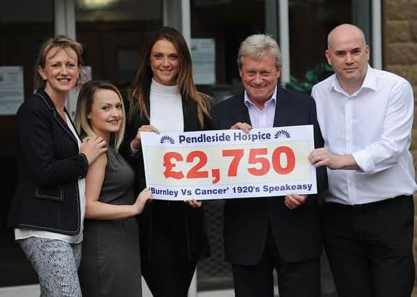 Cheque presentation to  Pendleside Hospice for from a casino night at Turf Moor as part of Burnley V Cancer. From the left, 
hospice Fundraising Manager Christina Cope, Lucy Birch, Lauren Fallows, Alan Simpson and John Fallows.
