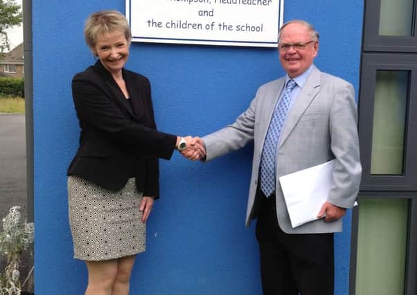 Retiring headteacher Ruth Thompson with Chairman of Governors David Leeming at Reedley Primary School's new extension. (S)