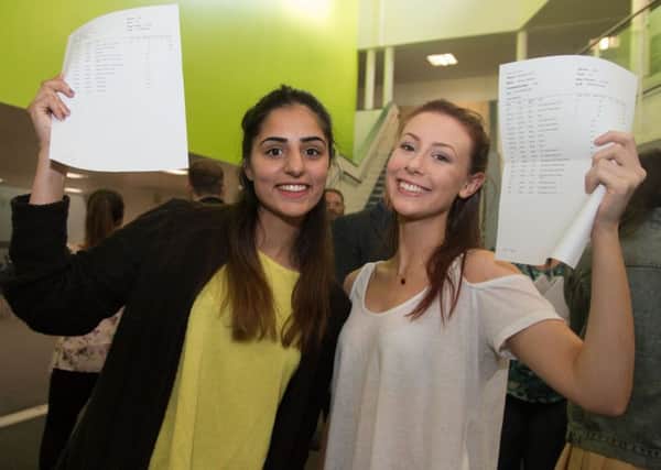 Thomas Whitham Sixth Form students Maria Shah and Emma Hitchon celebrate their A-Level success.