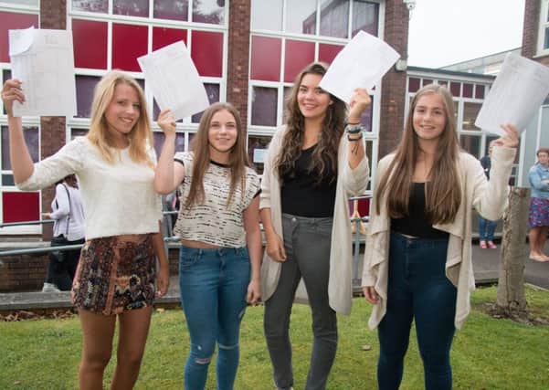 St Augustine's students Lucy Wright, Rebekah Maher, Pippa Kett and Eve Philippides celebrate their GCSE results.