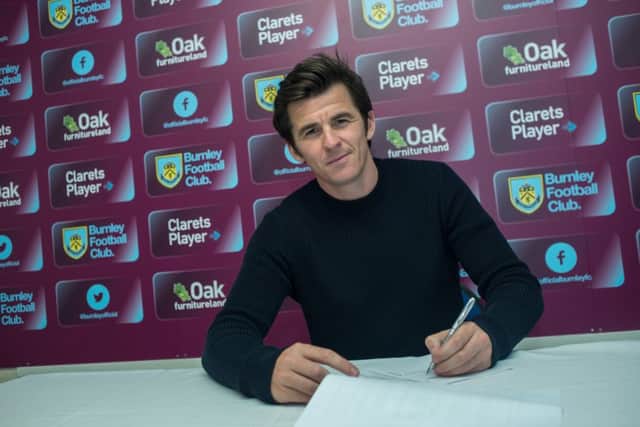 Joey Barton has signed on a free transfer after being released by QPR