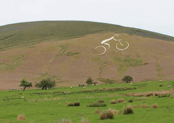 A giant cyclist constructed from 1,500 metres of horticultural fleece is being installed on Pendle Hill overlooking Clitheroe this week. This image is for illustrative purposes only and shows the Barley side of Pendle Hill, not the Nick.(s)
