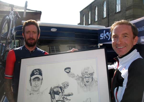 Waddington resident Craig Holden was delighted when Sir Bradley Wiggins signed his pencil drawing. (s)