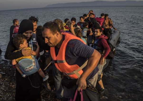 A group of Syrians and other refugees fleeing their homeland