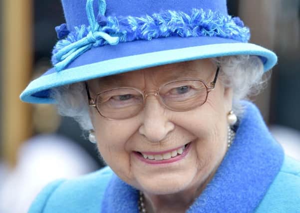 Queen Elizabeth II smiles as she arrives at Tweedbank, on the day she becomes Britain's longest reigning monarch. Photo: Owen Humphreys/PA Wire