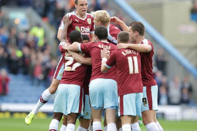 Burnley's David Jones is swamped by his team-mates as he celebrates scoring the opening goal