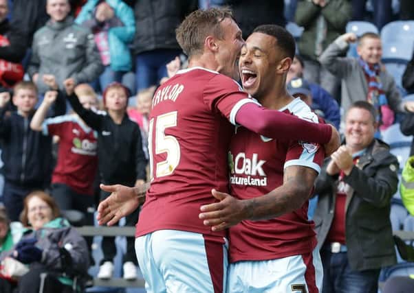 Burnley's Andre Gray celebrates scoring the third goal with team-mate Matthew Taylor