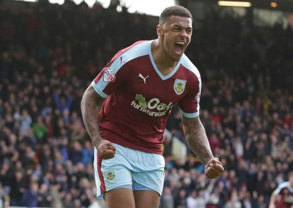 Burnley's Andre Gray celebrates scoring his sides third goal 

Photographer Stephen White/CameraSport

Football - The Football League Sky Bet Championship - Burnley v Sheffield Wednesday - Saturday 12th September 2015 -  Turf Moor - Burnley

© CameraSport - 43 Linden Ave. Countesthorpe. Leicester. England. LE8 5PG - Tel: +44 (0) 116 277 4147 - admin@camerasport.com - www.camerasport.com