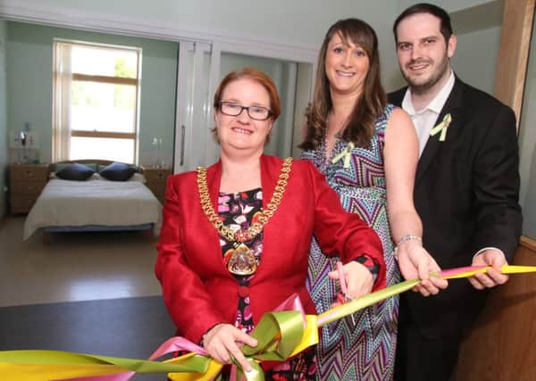 The Mayor of Burnley, Coun. Liz Monk offically opens the new serenity suite at Burnley General Hospital watched by Joanne and Mark Edwards.