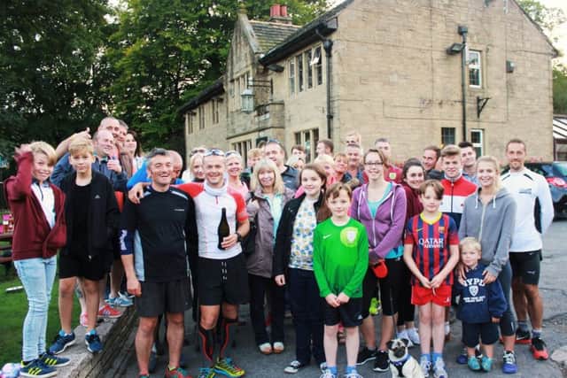 From The Abbey To The Hill Charity Run team being congratulated by family and friends at Pendle Inn in Barley.