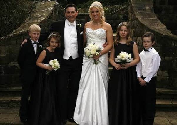 Dr Robert Grayson and his wife Kirsty with their children on their wedding day on 2012. (s)