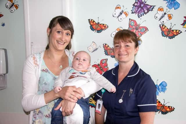 Joanne Edwards in the Butterfly Serenity suite with her baby son Toby and midwife Louise Bardon.(s)