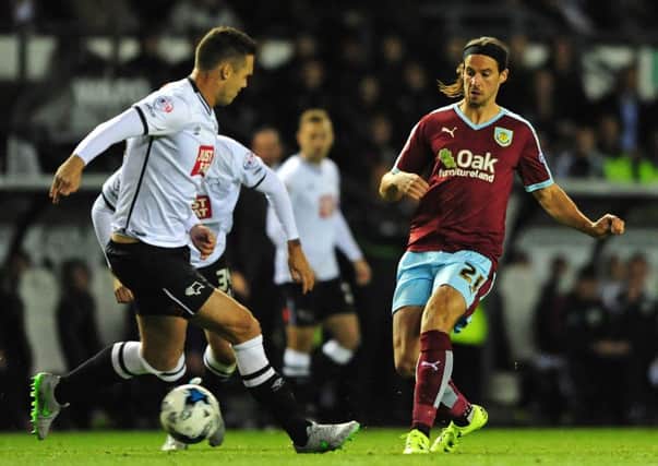 George Boyd knocks the ball past Derby County's George Thorne