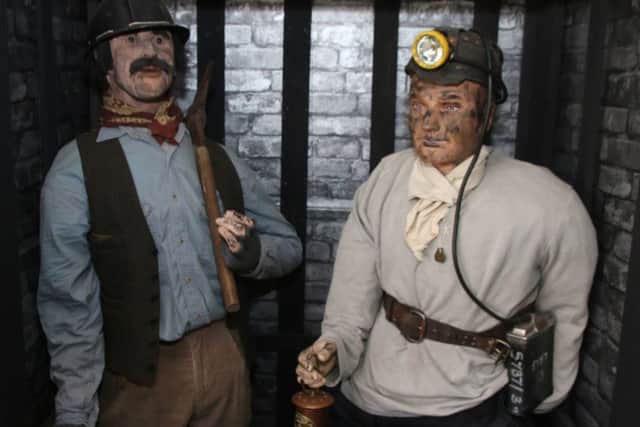 Two of the miners on display at the museum.