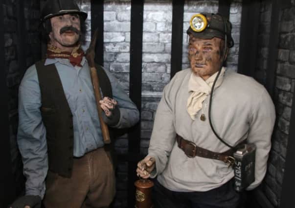 Two of the miners on display at the museum.