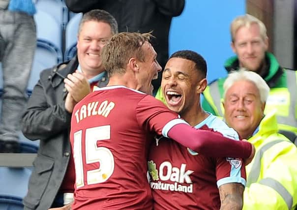 Burnley's Andre Gray (right) celebrates scoring his sides third goal with Matthew Taylor 
Burnley FC v Sheffield Wednesday
Sky Bet Football Championship game held at Turf Moor on the 12/09/2015
Pic by John Rushworth
Football Images are covered by DataCo Licence agreements
For editorial use only
No Free Use permitted