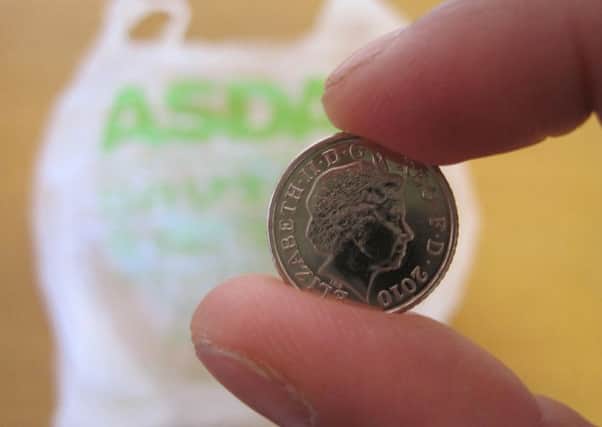 Supermarket shoppers now must pay 5p for single-use carrier bags under a new law introduced in England to stem litter and help wildlife. Photo: Benjamin Wright/PA Wire