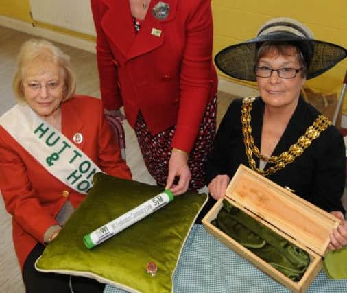 from left, Kathleen Collinge, President of Hutton and Howick WI, Mary Gibson, Chairman of Lancashire WI Federation and Mayor of South Ribble, Coun Dorothy Gardner with the Womens Institute Baton which is visiting every federation