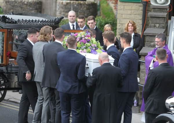 Wil Handford's coffin is carried into St Peter and St Paul's RC Church.