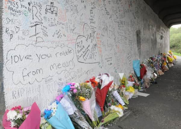 Floral tributes for Robbie Williamson (11) who died last week after falling off the canal bridge on Lowerhouse Lane.