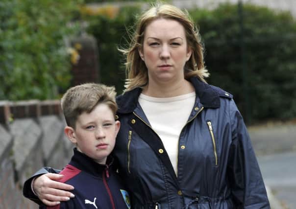 Connor McGowan (10) from Ightenhill has been placed in isolation at school because his haircut has been classed as extreme, he is pictured with his mum Michelle McGowan