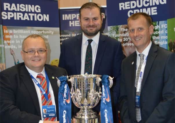 Coun. Joe Cooney and Andrew Stephenson MP with the The Football League Trust. (S)