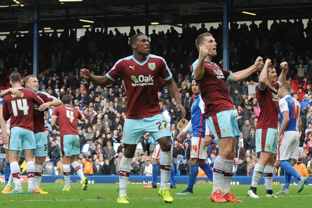 The Burnley players celebrate at the final whistle
