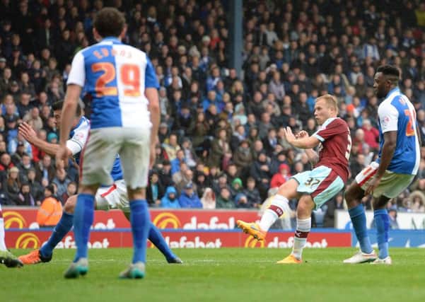 Burnley's Scott Arfield (second right) scores his side's first goal during the Sky Bet Championship match at Ewood Park, Blackburn. PRESS ASSOCIATION Photo. Picture date: Saturday October 24, 2015. See PA story SOCCER Blackburn. Photo credit should read: Anna Gowthorpe/PA Wire. RESTRICTIONS: EDITORIAL USE ONLY No use with unauthorised audio, video, data, fixture lists, club/league logos or "live" services. Online in-match use limited to 45 images, no video emulation. No use in betting, games or single club/league/player publications.